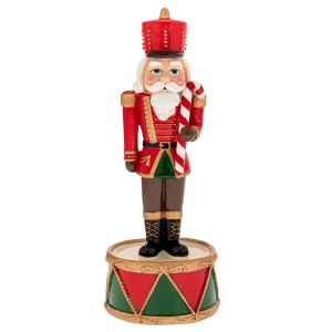 КОЛЕДНА ЧЕРВЕНА ПОЛИРЕЗИНОВА ЛЕШНИКОТРОШАЧКА НА ОСНОВА ЗА БАРАБАН С МУЗИКА И ДВИЖЕНИЕ 8X8X22 СМ