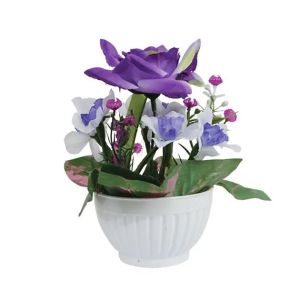 Purple mini flower arrangement in a plastic pot - h18 cm