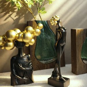 Decorative polyresin statuette black/gold girl with long hair in pompoms - 22X12X27CM 12/KIB